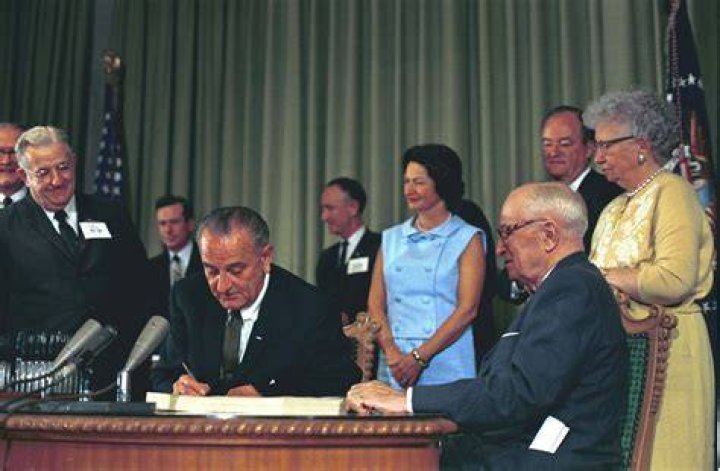 Which president implemented Medicare Medicaid?
